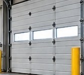 Sectional overhead door with window panels